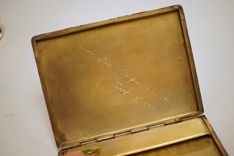 Two George V engine turned silver cigarette cases, largest 12.6cm, together with a pair of Asprey & Co silver ashtrays, a small silver dish, a silver condiment, six silver napkin rings, seven plated items and a quantity